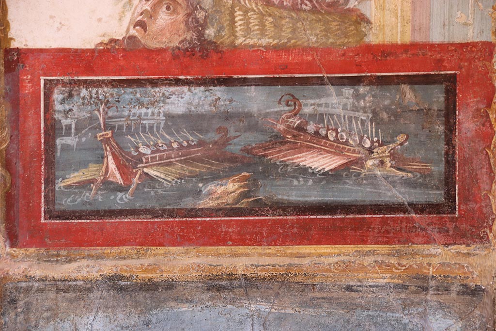 VI.15.1 Pompeii. October 2024. North wall of exedra with detail of the naval scene. Photo courtesy of Klaus Heese.