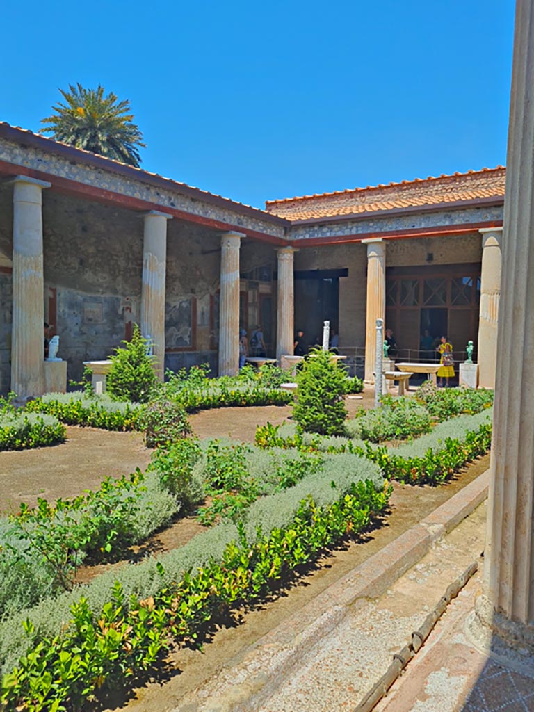 VI.15.1 Pompeii, June 2024. 
Looking north-west across peristyle from south-east corner. Photo courtesy of Giuseppe Ciaramella.
