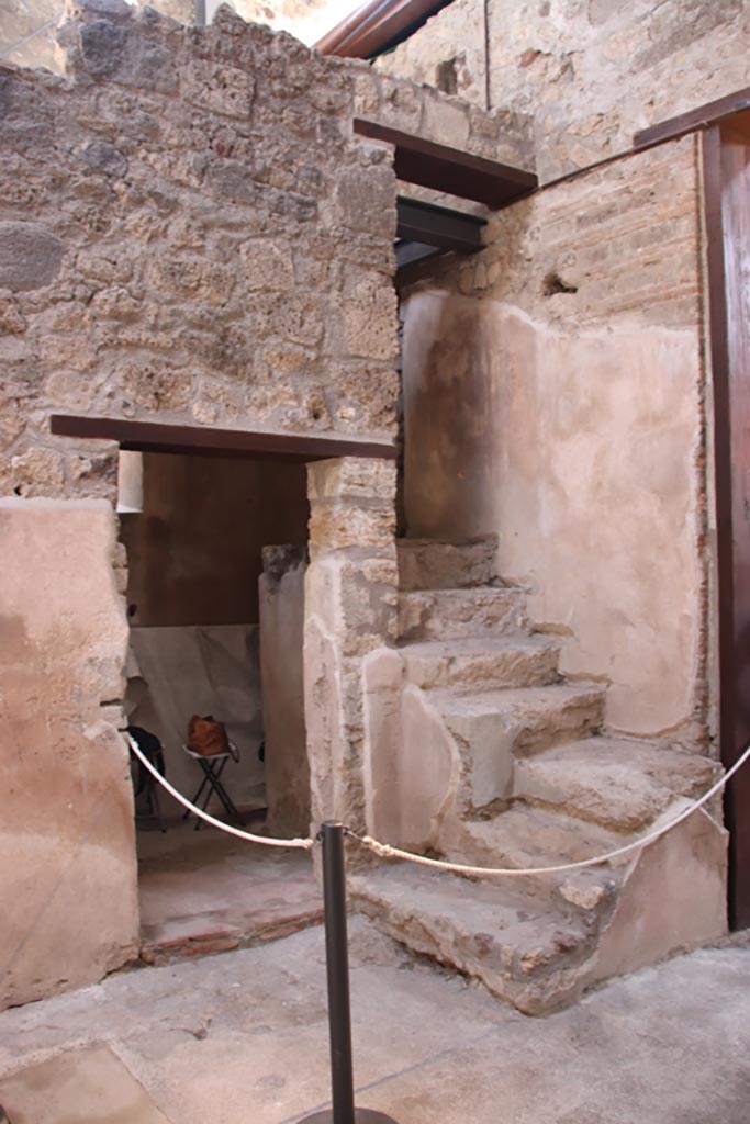 VI.15.1 Pompeii. October 2023. 
South-east corner with doorway to room below steps. Photo courtesy of Klaus Heese.
