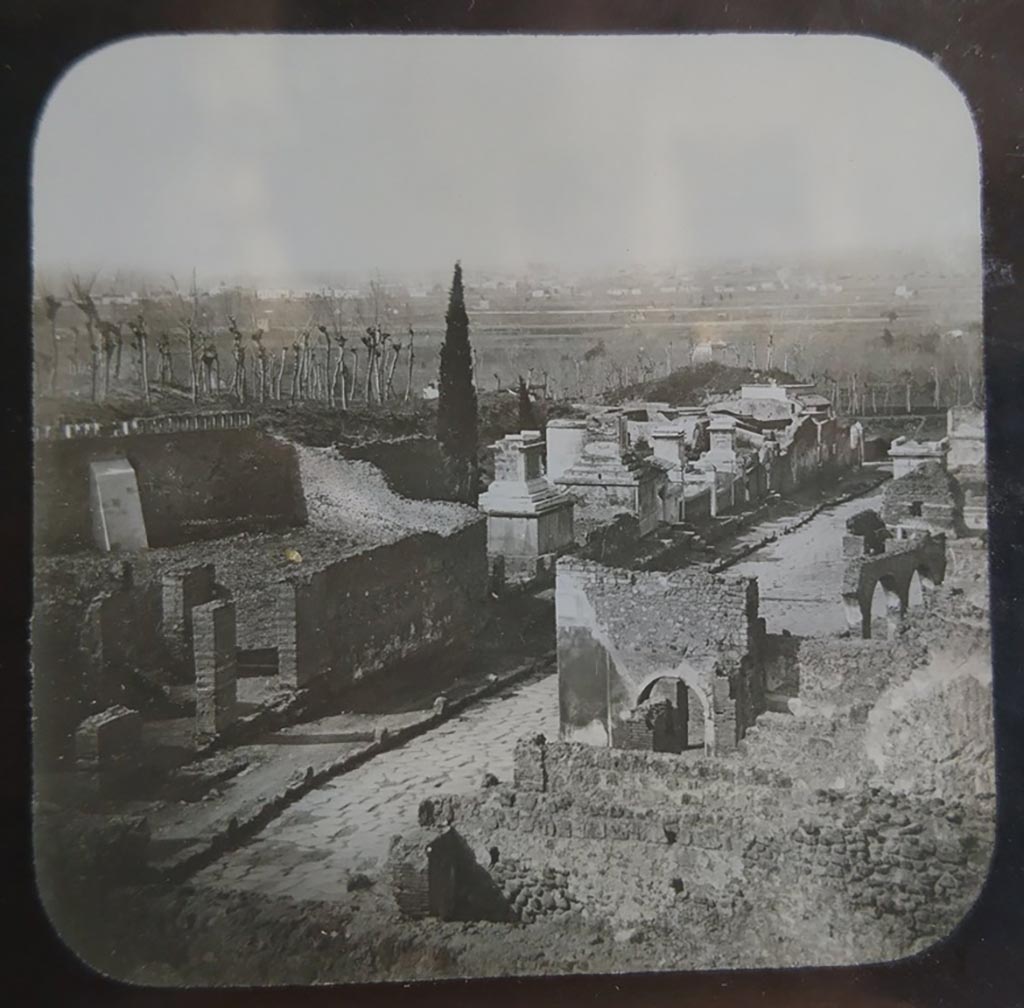 HGW15 and HGW15a Pompeii, on left. Part of the Villa of Cicero, Pompeii. c.1900. C. and G. Lantern slide published by A. Laverne. 
Looking north-west across Via dei Sepolcri, with entrance doorways and peristyle of Villa of Cicero, visible on upper left.  
