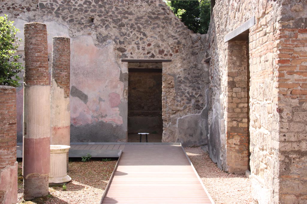 HGW24 Pompeii. Villa of Diomedes. May 2024.  
Looking south towards doorway to room in south-west corner of peristyle. Photo courtesy of Klaus Heese.
(Villa Diomedes Project – area 2 with doorway to area 18).
(Fontaine, room 2,9).
