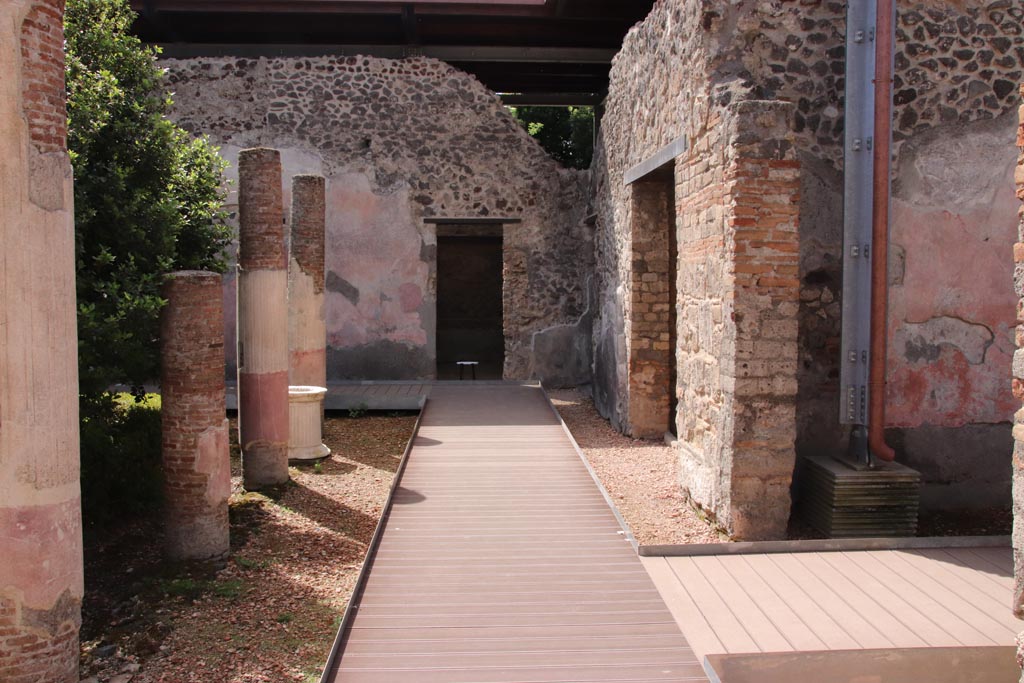 HGW24 Pompeii. Villa of Diomedes. May 2024. Looking south along west portico from ala. Photo courtesy of Klaus Heese.