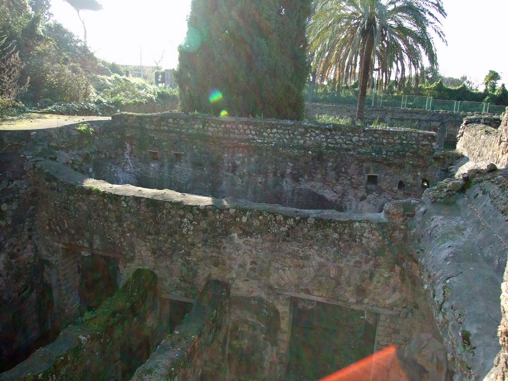 HGW24 Pompeii. December 2006. Looking west, down onto lower area to south of terrace. 
(Villa Diomedes Project – looking across area 52 on left, corridor 50, and area 53, on right).
 (Fontaine, looking across rooms (from left) 5,4, corridor 5,3, and 5,5, on lower right.
These rooms would have looked out onto the covered portico around the garden area).
No.78 on the plan of La Vega would have been found on the unroofed walkway around the top of the portico, on the south side of the garden area (approximately in this photo, on the upper middle left, flat area). (Fontaine, south side of garden terrace/walkway, near “A” on upper level.
No.80 would have been found on the upper level terrace, approximately where the “red” sunlight has caught the camera lens. This part of the terrace has now collapsed. (Fontaine, near “A” the garden terrace/walkway, west of room 4,5 on upper level.
