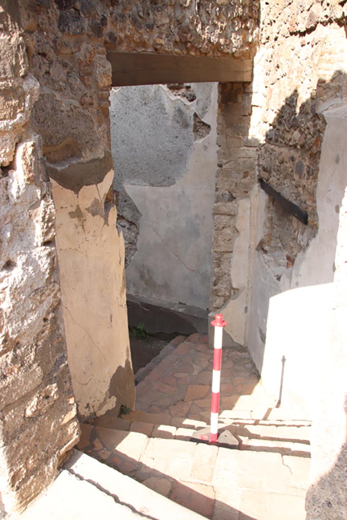 HGW24 Pompeii. Villa of Diomedes. October 2023.
Looking north through doorway to lower floor. Photo courtesy of Klaus Heese.
