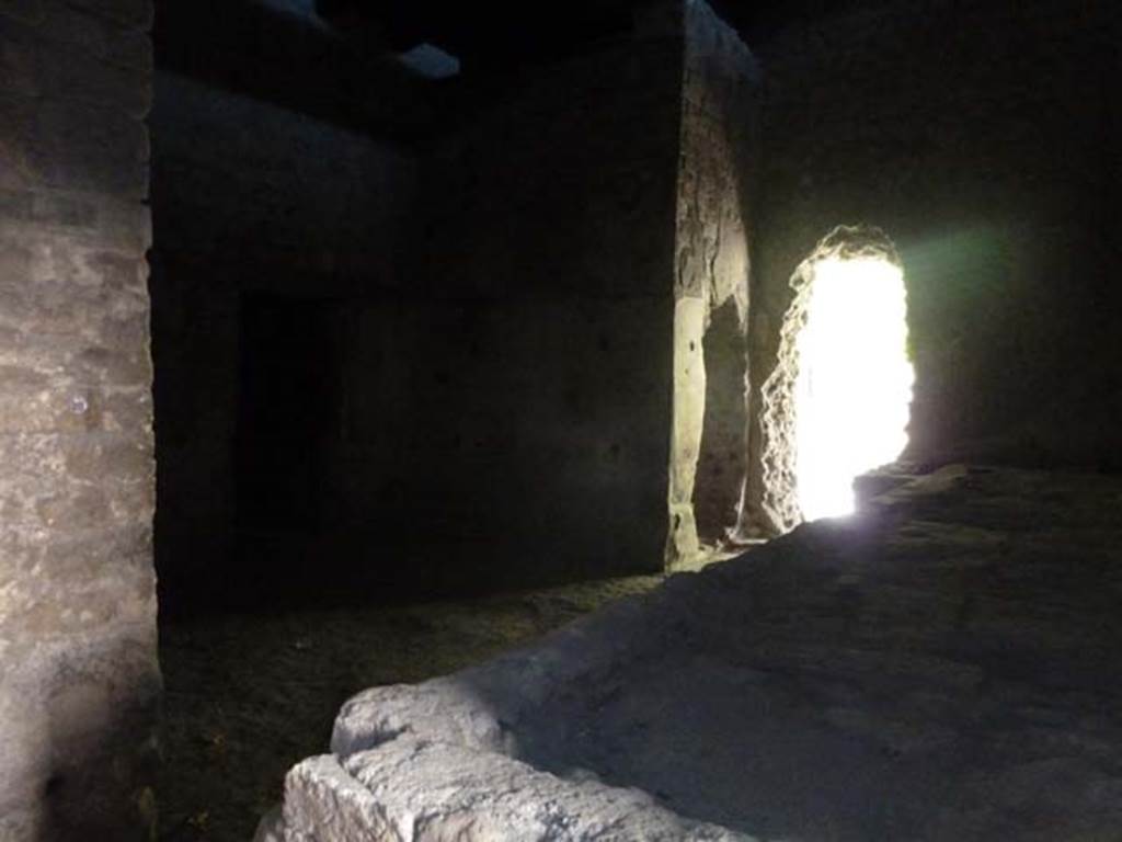 Villa San Marco, Stabiae, September 2015. 
Room 26, looking south-west across bench/hearth towards two adjacent holes made by the Bourbon excavators while tunnelling, one to room 27 and one to room 20.
