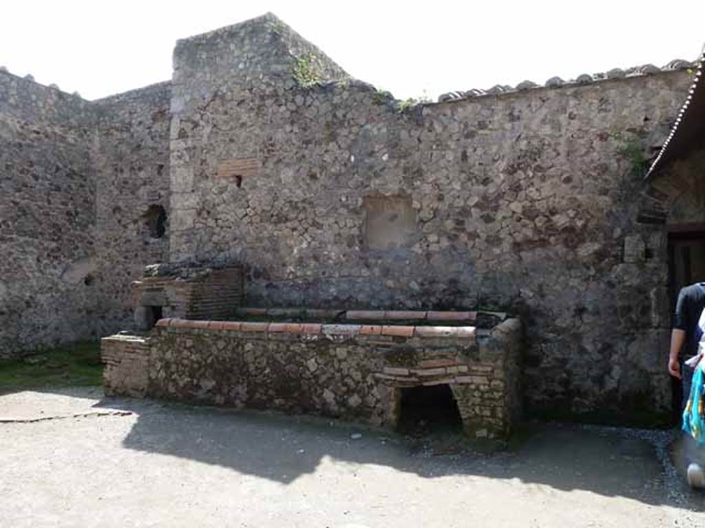 Villa of Mysteries, Pompeii. May 2010. Room 61, west wall with hearth and oven, and remains of niche.
