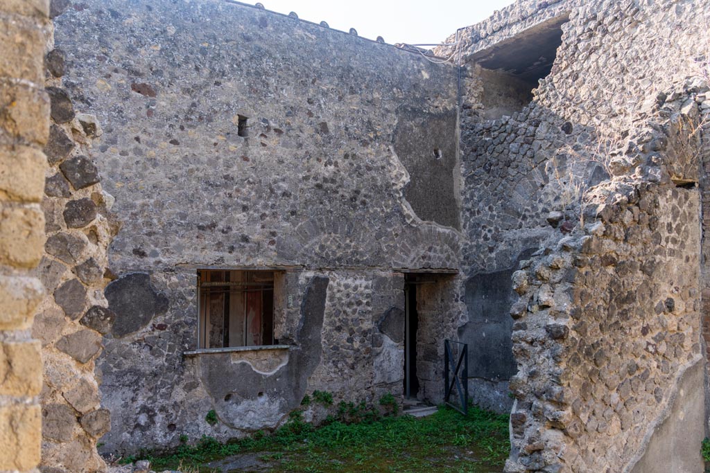 Villa of Mysteries, Pompeii. October 2023. 
Looking south from room 25, across room 26, towards doorway onto portico of Peristyle D. Photo courtesy of Johannes Eber.
