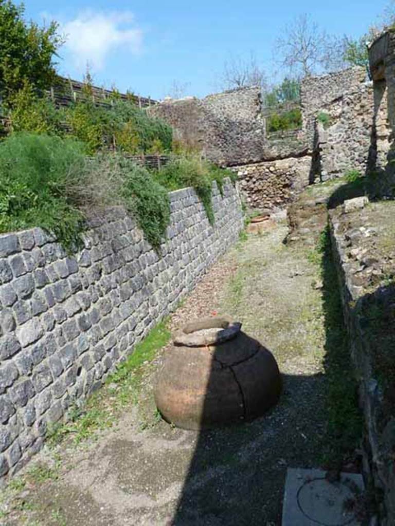 Villa of Mysteries, Pompeii. May 2010. Looking east along north side of villa, towards the wine cellar.