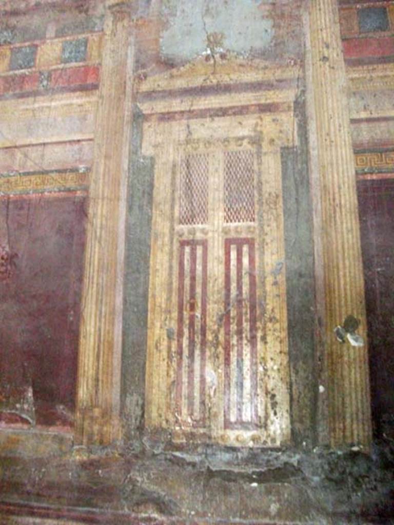 Villa of Mysteries, Pompeii. May 2010. Detail of painted doorway on north wall in room 6, oecus.