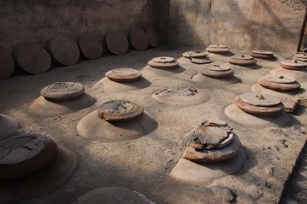 Villa Regina, Boscoreale. September 2021. Room I, cella vinaria, looking south-east across dolia. Photo courtesy of Klaus Heese.