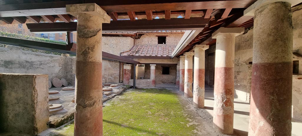 Villa Regina, Boscoreale. December 2023. Looking south across north portico from triclinium IV. Photo courtesy of Miriam Colomer.