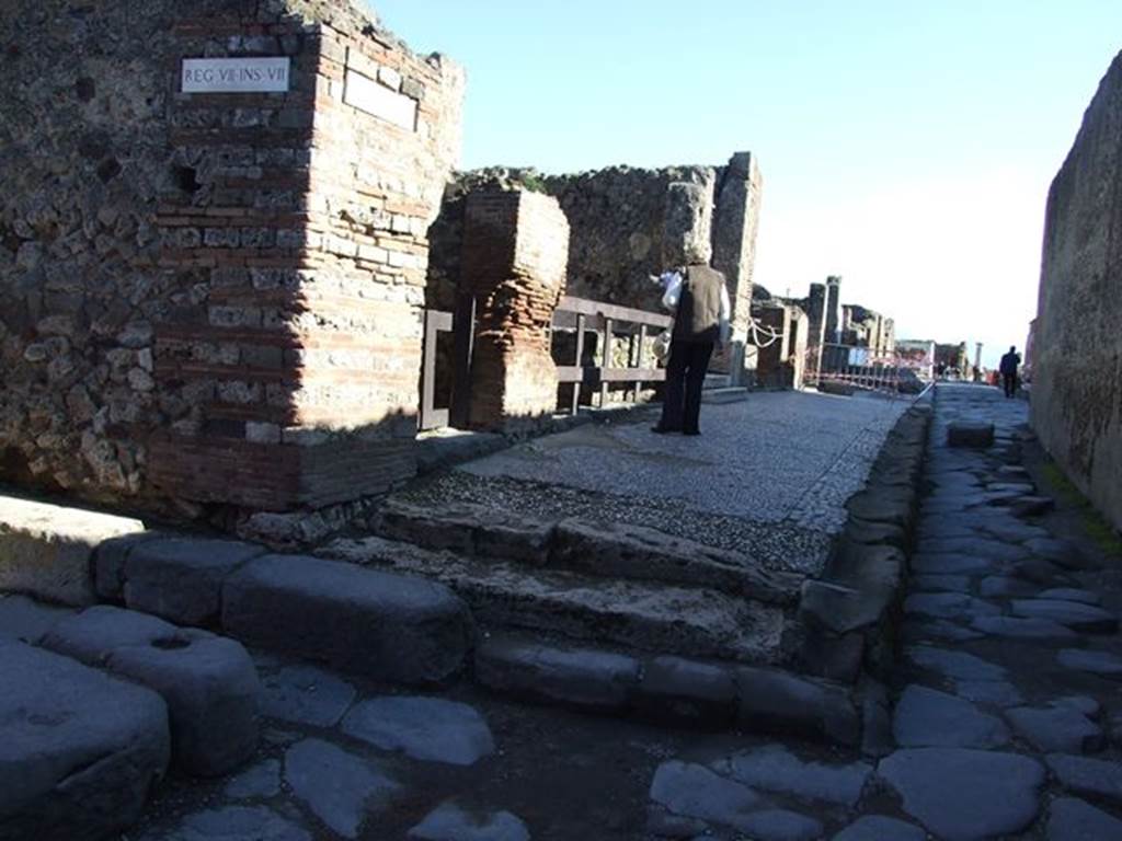 Via Marina with Vicolo del Gigante to the left (north). Looking east to VII.7.12 on corner. March 2009.