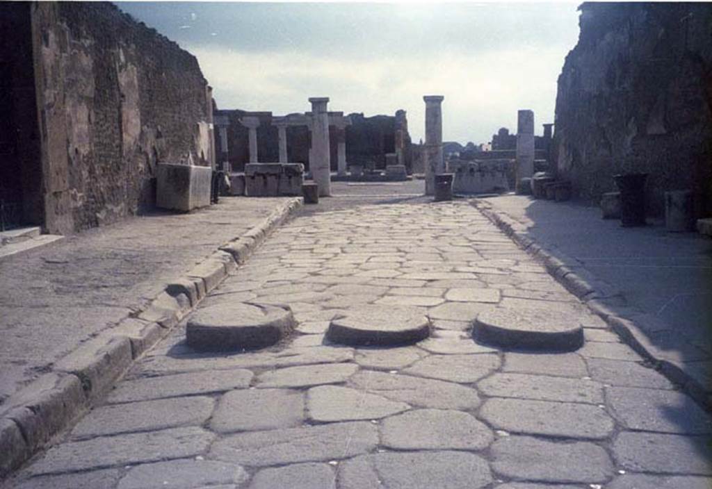 Via Marina, July 2011. Looking east between VII.7.32 the Temple of Apollo and VIII.1, towards the Forum. Photo courtesy of Rick Bauer. 
