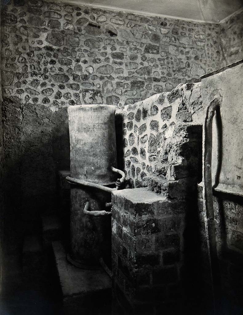 Boscoreale, Villa della Pisanella. 1931? Room L,  Praefurnium  or Boiler room showing water tanks and pipes.
Lettering on photo - Pompei - Museo Prisco. "Il Calidarium" della villa.” 
Typewritten lettering on piece of paper pasted onto rear reads: Pompeii. Capt. Saint, May 1931.
Photo courtesy of Wellcome Collection. CC BY 4.0
