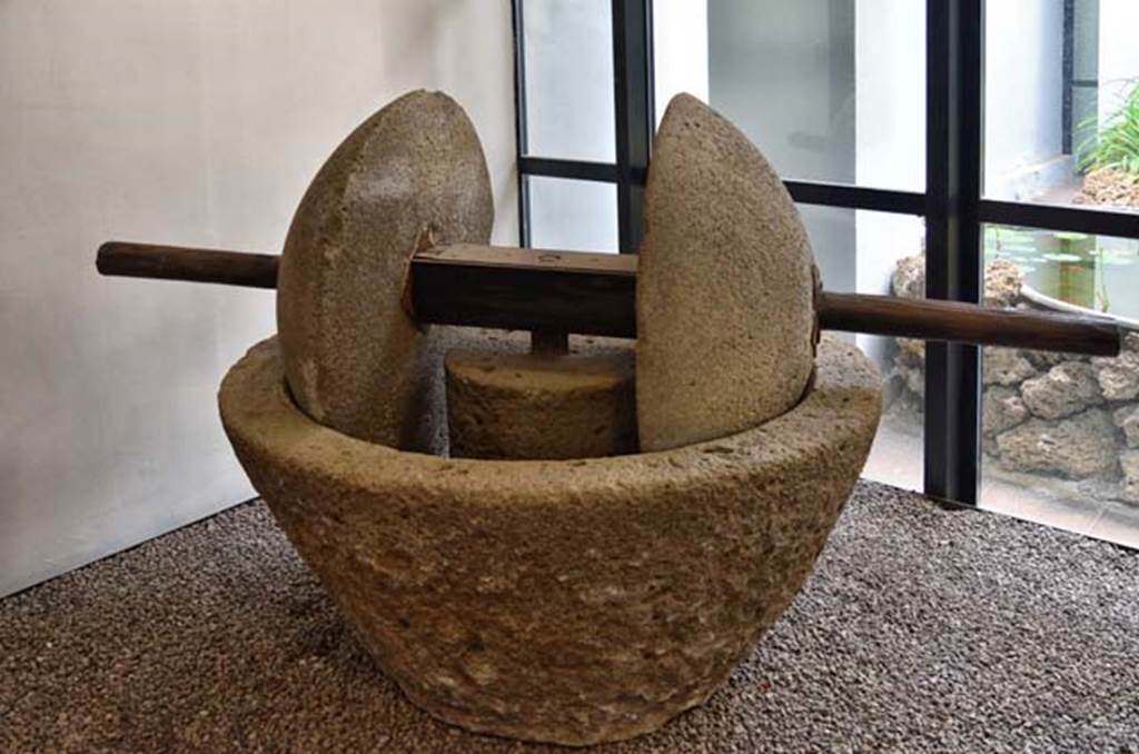 Villa della Pisanella, Boscoreale. April 2018. Oil mill (trapetum) consisting of a frustoconical tub (catillus) and by two wheels of a spherical cap (orbes).
Now in Boscoreale Antiquarium. Photo courtesy of Ian Lycett-King. 
Use is subject to Creative Commons Attribution-NonCommercial License v.4 International.
