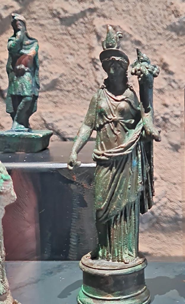 Villa della Pisanella. March 2024. Photo courtesy of Giuseppe Ciaramella.
Bronze statuette of Isis/Fortuna (1st century AD). (Statuette di Iside/Fortuna, bronzo, I sec. d.C).
On display in exhibition in Palaestra entitled – “L’altra Pompei, vite comuni all’ombra del Vesuvio”.
