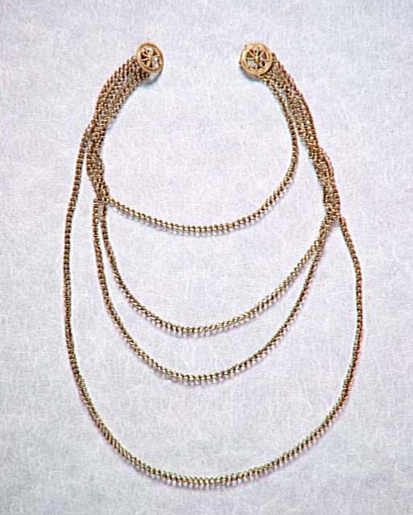 Villa della Pisanella, Boscoreale. Gold double chain. Eight-spoke wheels allowed the chain to be fixed on your shoulders.
Chane-baudrier (double chane). Des rouelles  huit rais devaient permettre de fixer la chane sur les paules.
Now in the Louvre, inventory number BJ495. Photo  RMN-Grand Palais (muse du Louvre)/Herv Lewandowski.
See De Villefosse H., 1899. L'argenterie et bijoux d'or du trsor de Boscoreale description des pices conserves au Muse du Louvre: Monuments et Memories 5 1899 with supplement 1902, p. 264, fig. 56.
