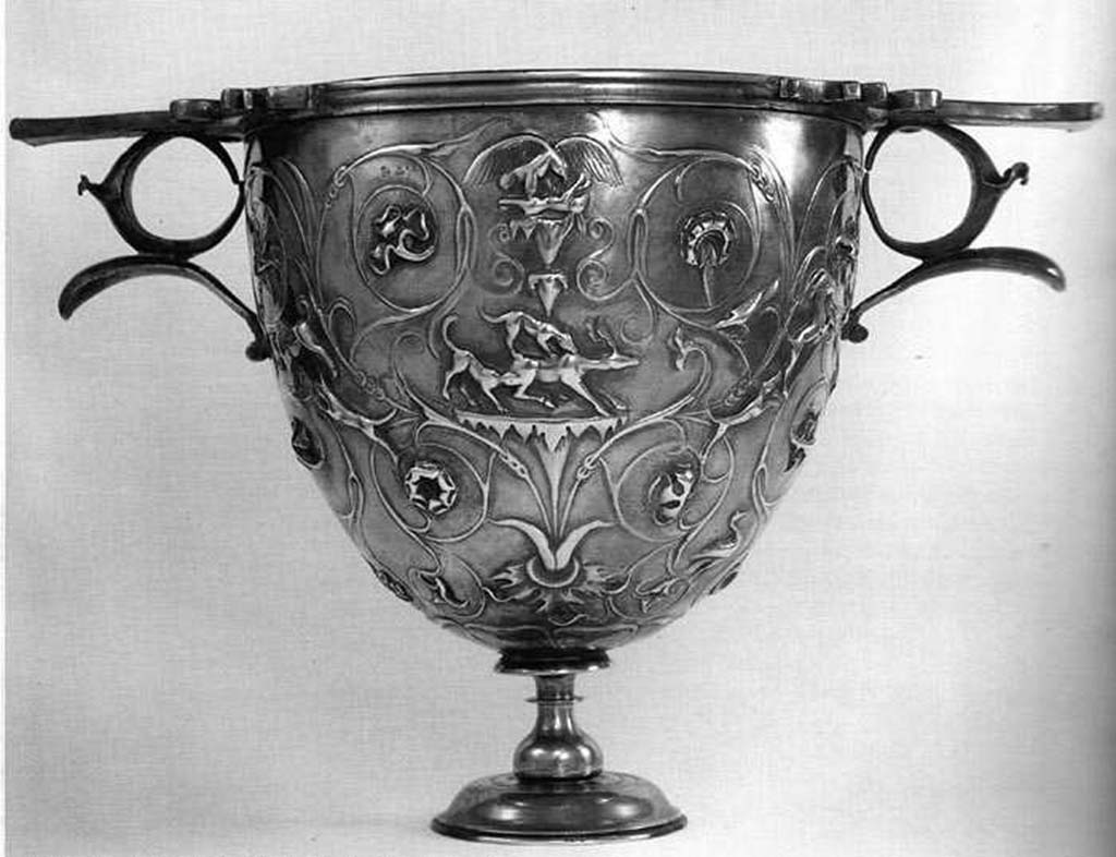 Villa della Pisanella, Boscoreale. Boscoreale silver. One of a pair of silver Cantharus decorated with floral scrolls and animal fights; eagle skinning a hare; dogs attacking a deer.
Vase  mler le vin, orn de rinceaux avec poursuites d'animaux : aigle dpeant un livre; chiens forant un cerf.
Now in the Louvre, inventory number BJ1907.
Voir/See De Villefosse H., 1899. L'argenterie et bijoux d'or du trsor de Boscoreale description des pices conserves au Muse du Louvre: Monuments et Memories 5 1899 with supplement 1902, pl. IX.
